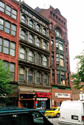 <three photo series> Evidence uncovered during investigations may help provide the necessary documentation to design an appropriate storefront. The storefront on a late 19th-century cast iron front building had been severely altered.  When the existing signage was removed, evidence of an early prism glass transom was found. A new compatible storefront will be designed incorporating this feature. Photos: NPS files