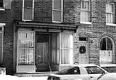 When the use of the building changes from commercial to residential, the large display windows still need to be retained. To provide privacy, shutters recessed behind the display area, simple curtains, or interior blinds may be considered rather than altering the existing historic storefront. Photo: NPS files