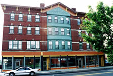 <two photo series>Compatible New Storefront Design. A non-historic storefront, shown before rehabilitation was replaced with a new compatible storefront that was based on traditional storefront elements and proportions, but was not a restoration. Photos: NPS files