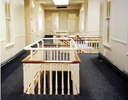 Historic stair railings in this Oakland, California, office building have been modified to meet safety code requirements while meeting the Standards for Rehabilitation. Photo: NPS files