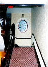 The interior rehabilitation included removal of the staircase enclosure in order to return this significant feature to its historic configuration. The oval stained glass window was re-installed on the landing.