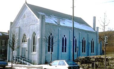 This modest Gothic Revival church building, featuring twelve distinctive stained glass windows, buttresses, and a gable roof, was built in 1858. It survived into the late 20th century virtually intact. Photos: NPS files.