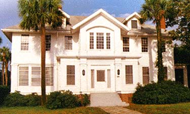 Constructed ca. 1918, this is one of three early 20th-century traditionally-styled residences remaining on a block of waterfront lots. The block is zoned commercial, and the other residences have been converted for that use. This house will be used for offices following rehabilitation. Photos: NPS files.