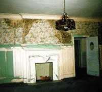 This shows the deteriorated dining room prior to rehabilitation work.