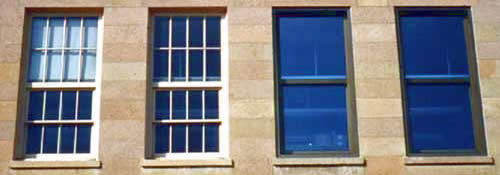 This photograph is keyed to two graphic 'start the program' buttons, YES and NO. While the windows (left) on the primary elevation of a historic commercial building should have been identified and preserved (YES), they were inappropriately replaced with tinted glazing (NO). Photo: Mike Jackson, Illinois State Historic Preservation Office.