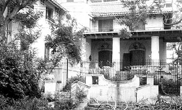 An early 20th century Mediterranean villa style house, individually listed in the National Register of Historic Places, had a formal garden, apparently conceived as an integral part of the total landscape design. There were terraces at the front and rear of the building. Photos: NPS files.