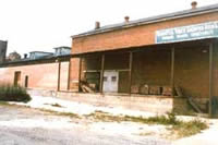 The existing roof, with pipe column supports, had been a simple addition to the original building. Since this roof was generally consistent with the industrial character of the building, it could have been retained and repaired.