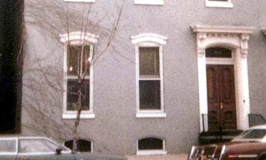 This late 19th Century rowhouse in a small historic district, has a two-story kitchen wing at the rear with a second-story porch featuring a decorative balustrade. (See photo, below, right.) Photos: NPS files.