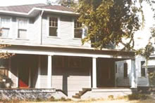 After rehabilitation, the porch has a continuous horizontal design it did not have before work when the twin porches provided separate entrances for the duplex. The historic character is lost.
