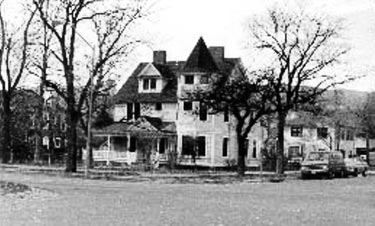 This 2 1/2 story wood frame house is in a city in one of the western mountain states. The front elevation faces a major street, but the side and rear elevations are not visible from the public way. Photos: NPS files.