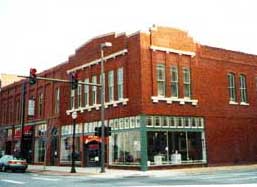 In an exemplary, multi-phased project that involved research, documentation, investigation, repair, replacement, and new construction, the overall goal was to rehabilitate the entire building--with its significant later changes--as a series of shops with a unified exterior design.