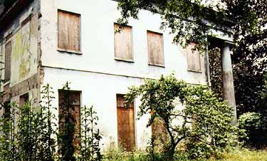 Built in 1847, this Greek Revival house featured stuccoed brick, a 2-story Doric entrance portico with a center entrance and full-size 1st-story  windows. Used as a residence for nearly 100 years by the same family, it was ultimately boarded up and vacant for a period of time. Photos: NPS files.