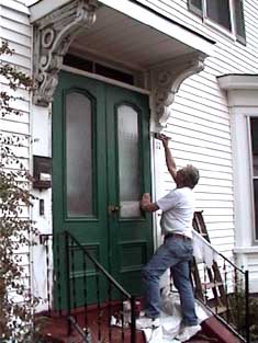 <photo> homeowner painting porch