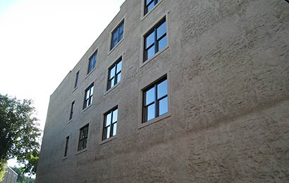 New windows added to the side of a historic building.