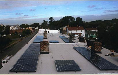 Solar panels placed in horizontal rows on a roof.