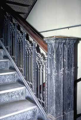 This is an image of a modest iron stairway that is an important interior feature and an important visual component of the building. Photo: NPS files.