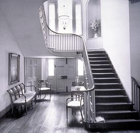 This is an image of a hallway--the circulation artery for the building. It leads both horizontally and vertically to other rooms and spaces, but is also  an open and inviting stairway. Photo: John Tennant.