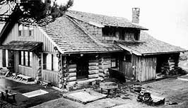 This is an image of the Southeast corner of the historic log house in May, 1991, as the property was being nominated to the National Register of Historic Places. Photo: Ann Durfee.