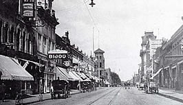 This is an image of what is now the North Main Historic District, Oshkosh, Wisconcin, in 1909. The black and white photo includes bicycles, buggies and the Bijou movie theater at the end of the horse-drawn age. Photo: Courtesy, August Tiedje.