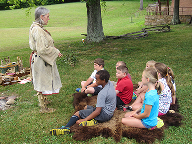 costumed interpreter with children