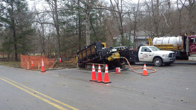 truck and workers on utility project