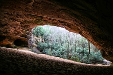 hiker in Sand Cave hiker in Sand Cave