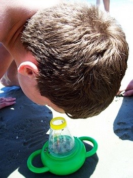 Boy_and_beach_magnifying_glass_small