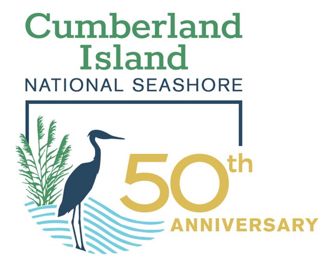 A logo with text 'Cumberland Island National Seashore 50th Anniversary'. there is a graphic of a heron, sea oats and waves.
