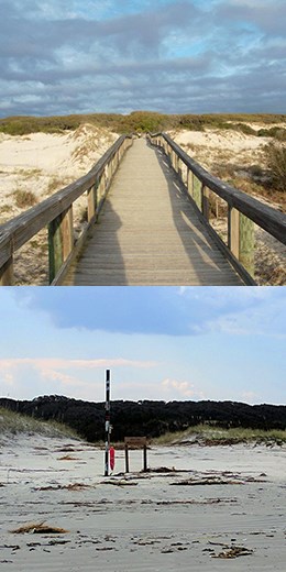 boardwalk and tall striped pole marking a crossing along the beach