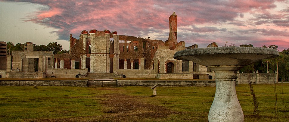brick and stone ruins of a large mansion