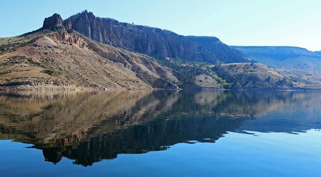A reflection of pinnacle formations into a body of water