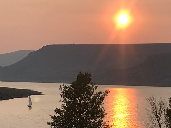 Sailboat and sunset in Cebolla Basin and Blue Mesa.