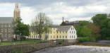 The Slater Mill (yellow) and Wilkinson Mill (stone), along the Blacktone River in Pawtucket RI