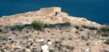 A storm gathers behind the pueblo at Tuzigoot