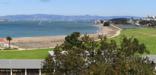 East view from Crissy Field overlook with old Coast Guard station on left and city on right