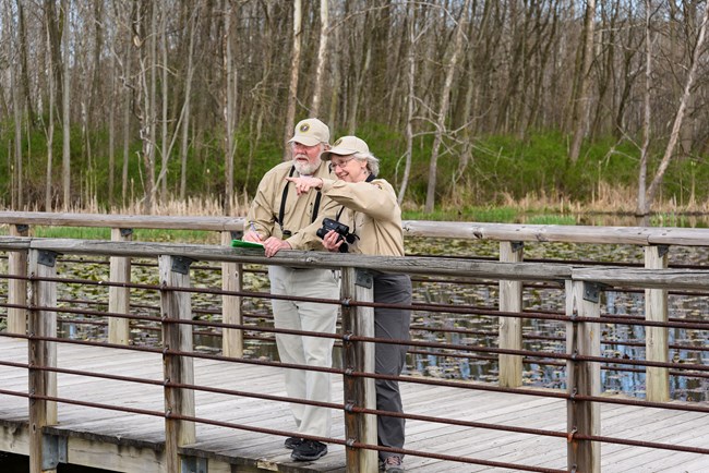 Volunteers observing wildlife at the Beaver Marsh in spring Volunteers observing wildlife at Beaver Marsh in spring