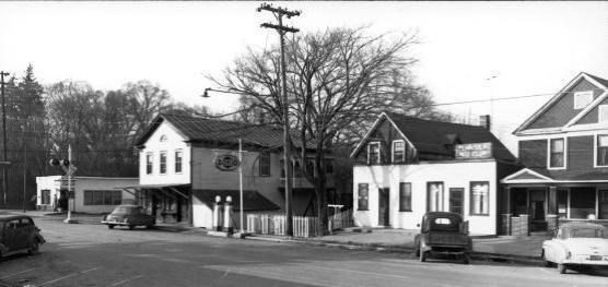 Black and white photo of Main Street, Peninsula, 1950s, including Scotty's Place and the Peninsula Nite Club.