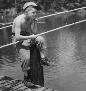 Historical photo of Boy fishing.