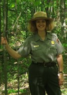 Ranger Arrye Rosser in woods in summer