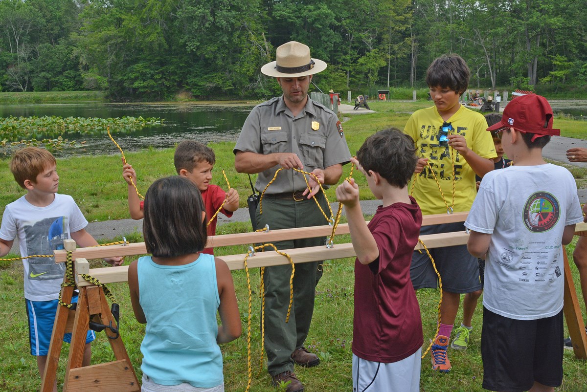 Ranger leading a program with a group of children. ranger leading a program for kids