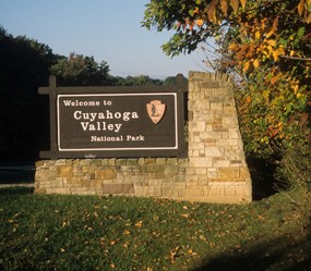 CVNP welcome sign near a wooded area