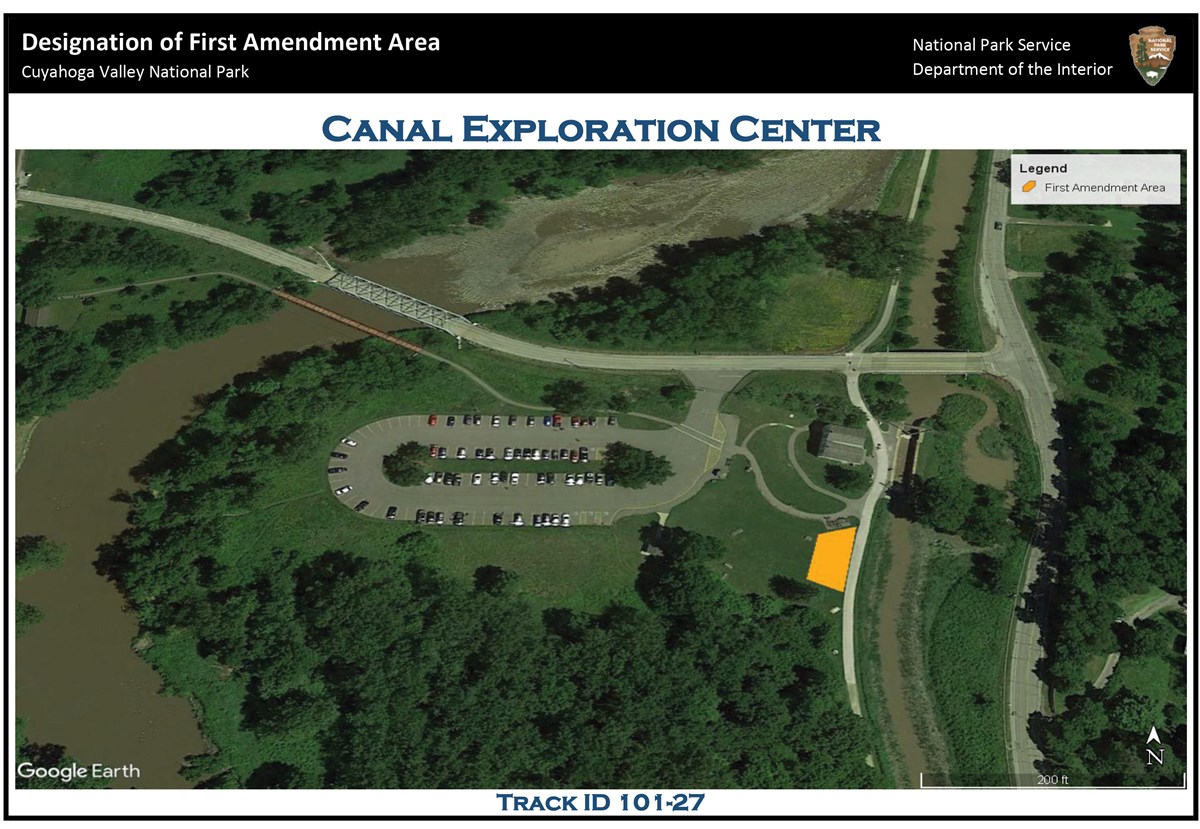Aerial view of the Canal Exploration Center (CEC) area; at center is the CEC parking lot; to the right, south of the building and west of the Towpath Trail a trapezoidal yellow polygon indicates the location of the first amendment area.