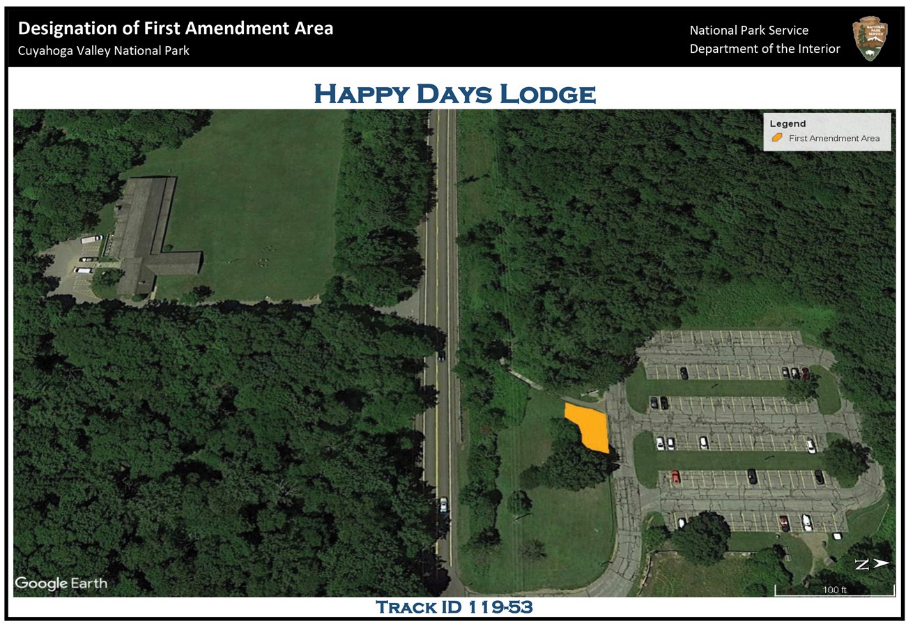 Aerial view of the Happy Days Lodge area; to the left is the lodge; to the right is the parking lot north of S.R. 303; between the parking lot and S.R. 303 is an irregularly shaped yellow polygon indicating the location of the first amendment area.