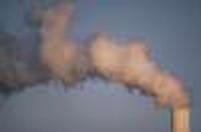 close-up photo of a smoke stack emitting dark smoke close-up photo of a smoke stack emitting dark smoke