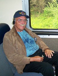 A man rides the Cuyahoga Valley Scenic Railroad train while listening to the fully accessible audio tour. A man rides the Cuyahoga Valley Scenic Railroad train while listening to the fully accessible audio tour.