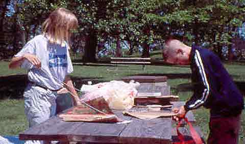 Children making sled kites. Children making sled kites.