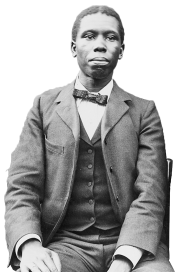 Paul Dunbar sitting, dressed in suit and tie