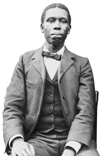 Paul Dunbar sitting, dressed in suit and tie
