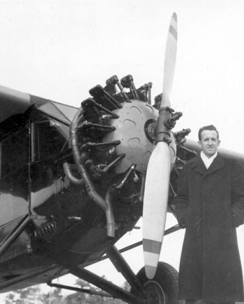 A man standing next to an airplane