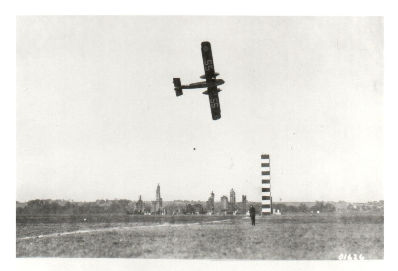 Air Race 1924 Black and white image of an aeromarine plane in flight above a striped pylon.